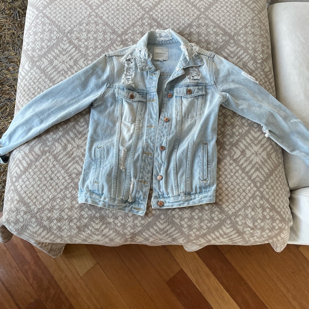 Light blue distressed denim jacket